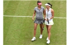 BIRMINGHAM, ENGLAND - JUNE 14: Caroline Garcia of France (R) and Shuai Zhang of China (L) during their match against Casey Dellacqua and Ashleigh Barty of Australia on day six of the Aegon Classic at Edgbaston Priory Club on June 13, 2014 in Birmingham, England. (Photo by Tom Dulat/Getty Images)